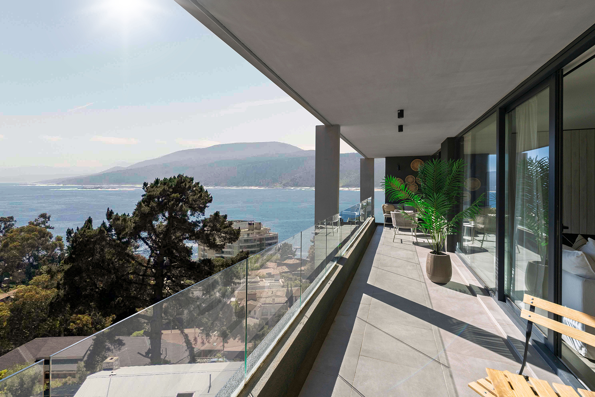 Vista aérea del proyecto Chagual en Papudo Alto, con edificios residenciales junto al mar en entorno costero.